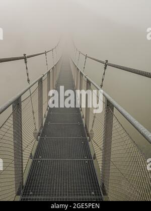 Suspension bridge in the fog, Stubnerkogel, Bad Gastein, Salzburger Land, Austria Stock Photo