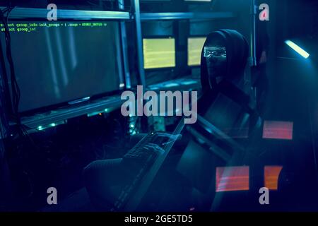Cyber hacker breaks into databases to obtain information using a computer. Cybercrime and data security concept. Stock Photo