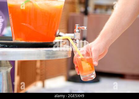 fruit punch in a drink dispenser at a party Stock Photo - Alamy