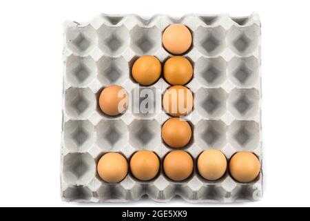 Eggs arranged in a number isolated on white background Stock Photo