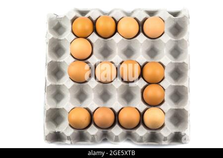 Eggs arranged in a number isolated on white background Stock Photo