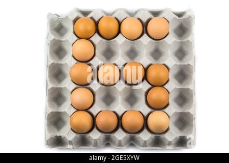 Eggs arranged in a number isolated on white background Stock Photo