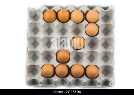 Eggs arranged in a number isolated on white background Stock Photo