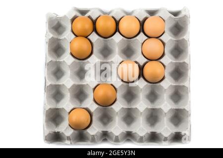 Eggs arranged in a number isolated on white background Stock Photo
