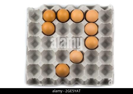 Eggs arranged in a number isolated on white background Stock Photo