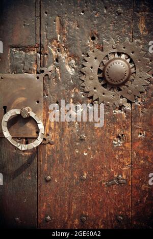 Old Studded Wooden Door with Metal Handle and Star Stock Photo