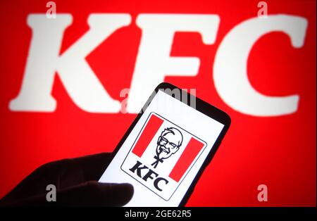 Ukraine. 16th Aug, 2021. In this photo illustration a KFC (Kentucky Fried Chicken) logo is seen on a smartphone and a pc screen. Credit: SOPA Images Limited/Alamy Live News Stock Photo