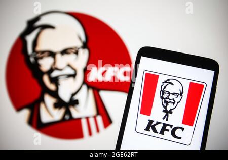 Ukraine. 16th Aug, 2021. In this photo illustration a KFC (Kentucky Fried Chicken) logo is seen on a smartphone and a pc screen. Credit: SOPA Images Limited/Alamy Live News Stock Photo