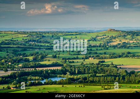 Scenic countryside view of Wharfedale from Otley Chevin (wide green sunlit valley, farmland fields, high crag, blue sky) - West Yorkshire, England UK. Stock Photo