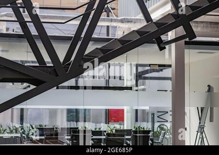 Creative factory interior in modern business center, empty workplaces with computers Stock Photo