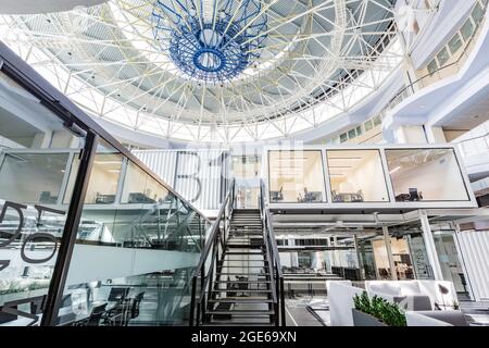 Big coworking space interior with private working cabinets for rent Stock Photo