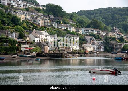 Noss Mayo and Newton Ferrers, Devon, England, UK. 2021.  Noss Mayo seen across The Yealm river from Newton Ferrers an attractive residential area Stock Photo