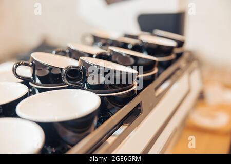 Collection of black coffee cups in cafeteria or coffee shop Stock Photo