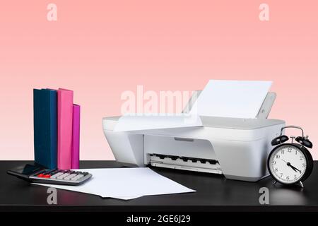 Compact home laser printer against pink background Stock Photo