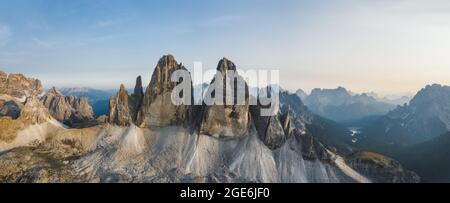 Aerial panoramic view of Tre Cime di Lavaredo mountain peaks during sunset, Dolomites, Italy Stock Photo