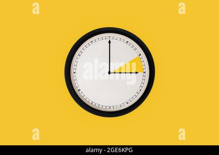 Summer time clock change on yellow background. Stock Photo