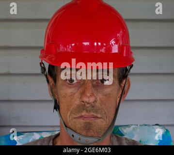 A Portrait of a Middle-Aged Male Wearing a Hard Hat Stock Photo