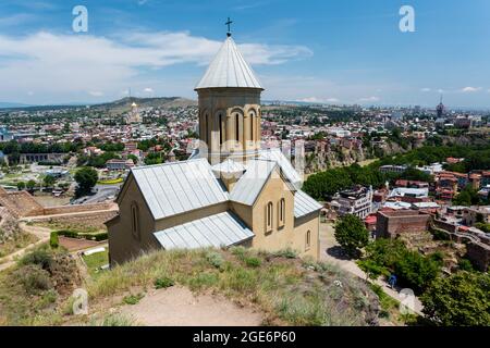 Tbilisi, Georgia - June 15, 2016: Saint Nicholas church in Narikala fortress and view of Tbilisi, Georgia, Europe Stock Photo