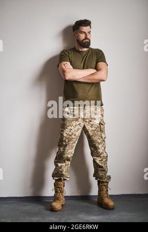 Full length portrait of a handsome and strong bearded soldier Stock Photo