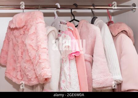 Hangers with Baby Clothes on Rack in Wardrobe Stock Image - Image of  background, closeup: 133731303