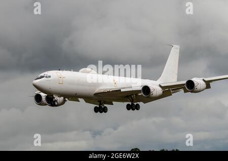 Boeing E-6B Mercury airborne command post and communications, control of nuclear weapons relay based on Boeing 707 jet plane. Landing in stormy clouds Stock Photo