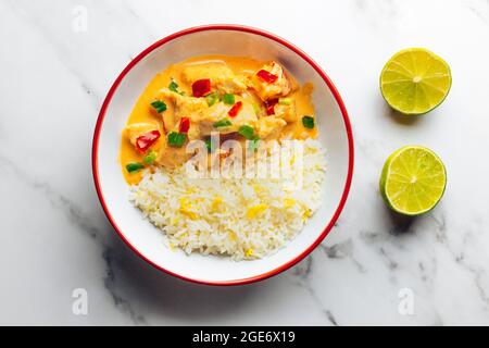 Thai Red Chicken Curry with Egg-fried Rice and Fresh Limes – FOODPIX WHITE Stock Photo