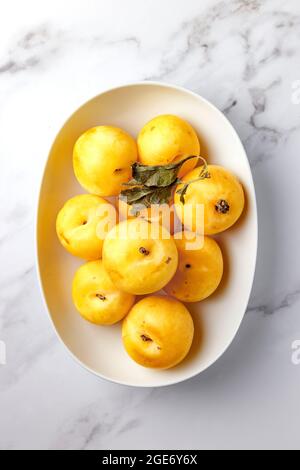 Fresh Bright Yellow Plums in a Group – FOODPIX WHITE Stock Photo