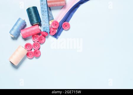 Sewing items from above. Flat lay composition with sewing accessories on light color background. Items for sewing, Sewing clothes, measuring tape Stock Photo