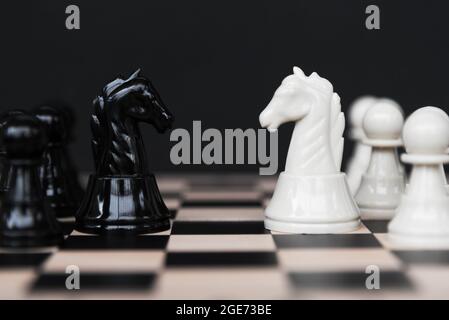 Competition - knight kingdom chess on Black Background Stock Photo