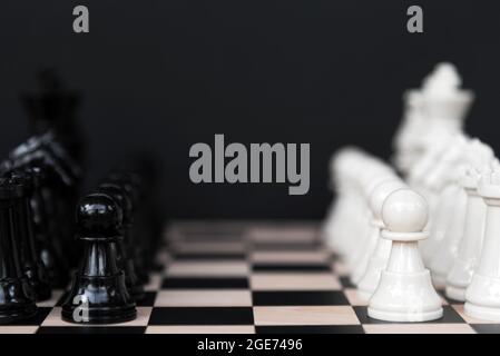 Black and White Chess Board on Black Background Stock Photo