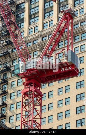 Detroit, Michigan - A construction crane next to an existing skyscraper in downtown Detroit. Stock Photo