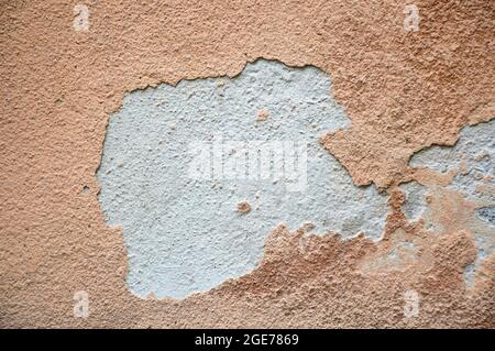 Old concrete wall with peeling plaster Stock Photo