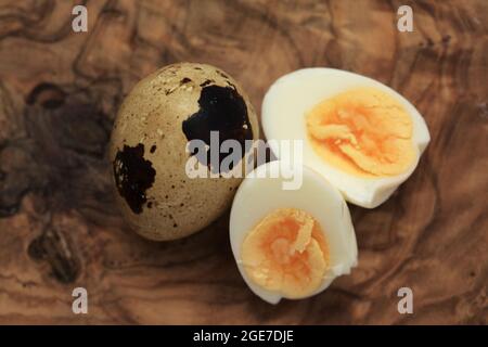 small boiled speckled quail eggs peeled Stock Photo