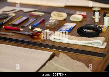 Set of sewing accessories on a wooden table Stock Photo