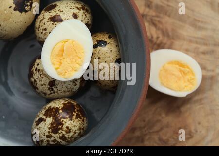 small boiled speckled quail eggs peeled Stock Photo