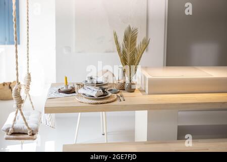 Served table for breakfast in a modern apartment Stock Photo