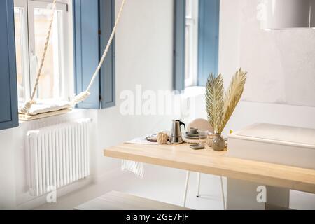 Served table for breakfast in a modern apartment Stock Photo