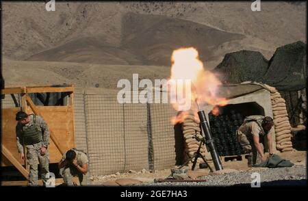 U.S. combat troops in Afghanistan - Indirect Fire Infantryman, assigned to 1-221 Cavalry Squadron, Nevada National Guard, fire an M121 120mm mortar at Combat Outpost Najil in Laghman Province Afghanistan November 11, 2009. The 1-221 was supporting the 4th Brigade Combat Team, also known as Task Force Mountain Warrior, was responsible for Nangarhar, Nuristan, Konar, and Laghman provinces in eastern Afghanistan. (U.S. Army Photo by Spc. Walter H. Lowell) Stock Photo