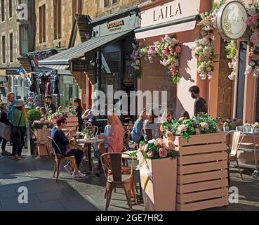 Edinburgh, Scotland, UK weather. 17th August 2021. Sunshine in the Scottish capital brought people out to enjoy the festivsl atmoshere. Pictured customers at Laila in Victoria Street. Credit: Arch White/Alamy Live News. Stock Photo