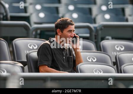 San Diego Padres general manager A. J. Preller talks on the phone before an MLB regular season game against the Colorado Rockies, Monday, August 16, 2 Stock Photo