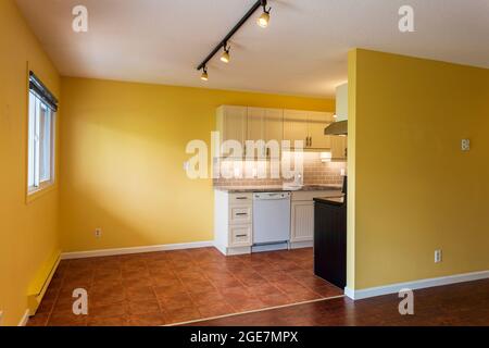 New renovation apartment rental kitchen with new appliances in a modern condo house with dining room. Stock Photo