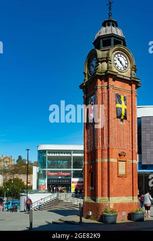 Bangor Clock, High Street, Bangor, Gwynedd, North Wales. Debenhams in the background and Bangor University in the distance. Taken in April 2021. Stock Photo