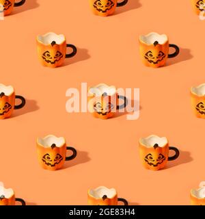Seamless pattern of empty Halloween fun cups on orange background. Stock Photo