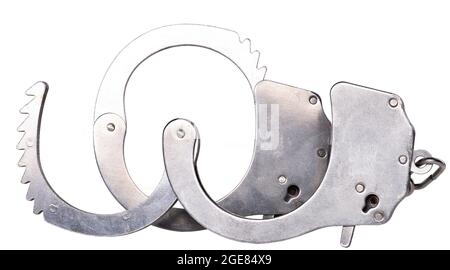 Metal handcuffs to restrain the hands of a criminal. Accessories for policemen working on the street. Isolated background. Stock Photo