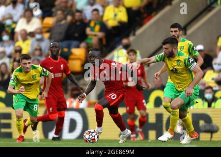 Sadio Mane of Liverpool in action with Grant Hanley of Norwich City - Norwich City v Liverpool, Premier League, Carrow Road, Norwich, UK - 14th August 2021  Editorial Use Only - DataCo restrictions apply Stock Photo