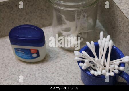 Vaseline, ear swabs and dental floss toothpick Stock Photo