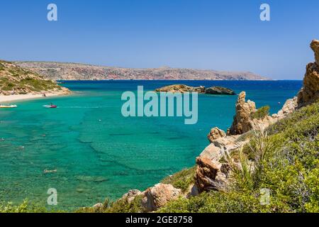 VAI, CRETE - 15 JULY 2021: Crowds of tourists on the picturesque palm fringed beach of Vai on the eastern coast of Crete (Greece) Stock Photo