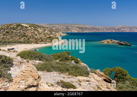 VAI, CRETE - 15 JULY 2021: Crowds of tourists on the picturesque palm fringed beach of Vai on the eastern coast of Crete (Greece) Stock Photo