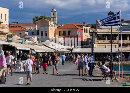 CHANIA, CRETE - JULY 22 2021: Crowds of tourists in the narrow streets of Chania old town on the Greek island of Crete. Despite the Coronavirus pandem Stock Photo