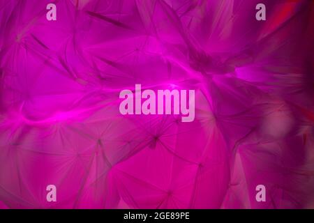 Backdrop of Flowing colorful fabric with light and shadows Stock Photo